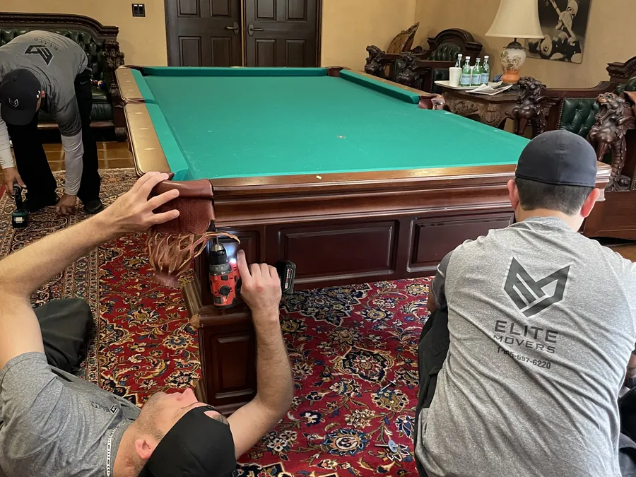 Taking down a billiard table before the move