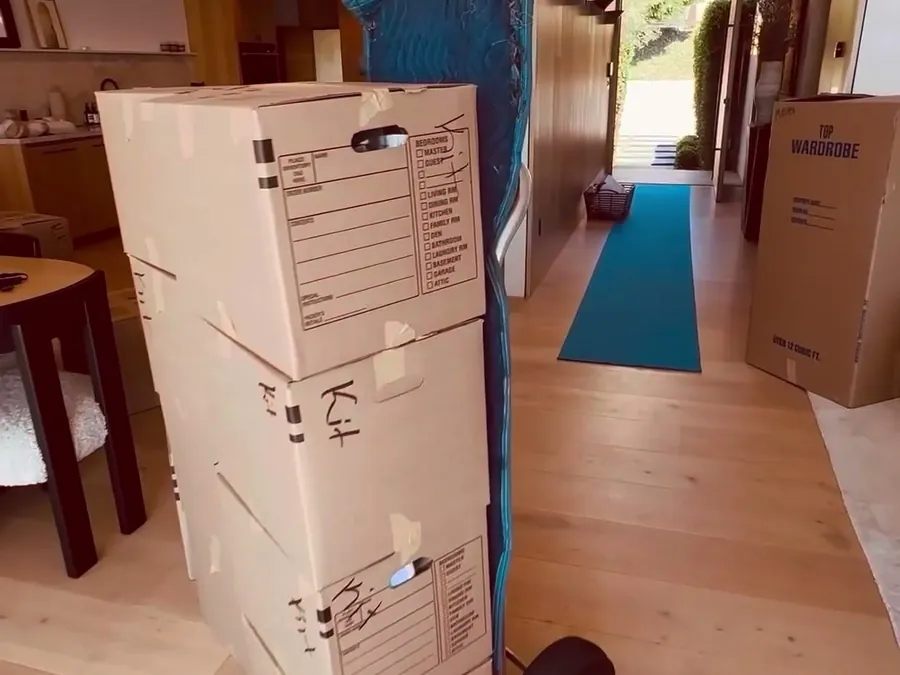 Boxed, labelled and stacked on a dolly, ready to load
