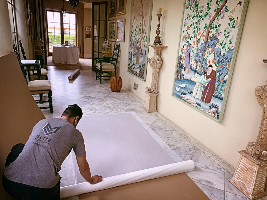 Rolling out floor protection before anything moves