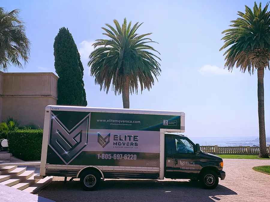 An Elite truck at a hillside estate